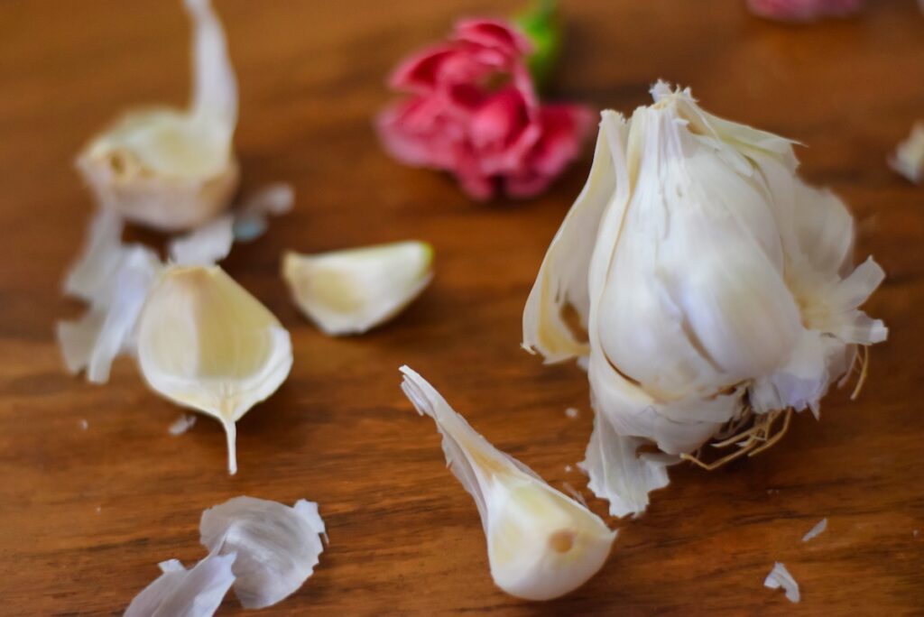 close-up-of-garlic-bulb-and-cloves-and-florals